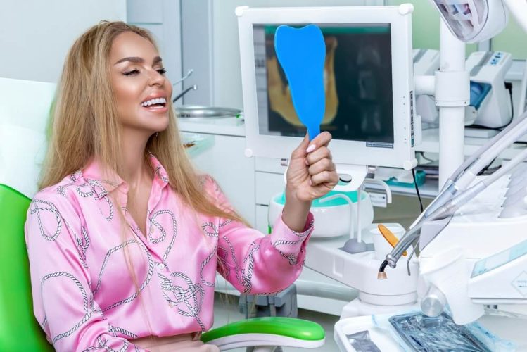newmarket family dental patient sits in dental chair after dental bonding