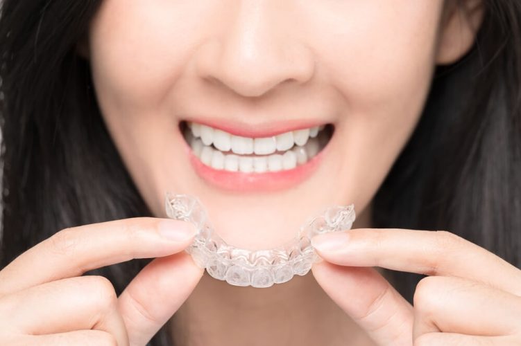 newmarket family dental patient wears clear aligners